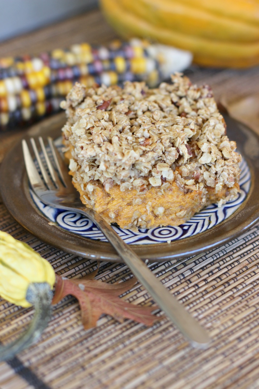 brown plate with a fork and a pumpkin square